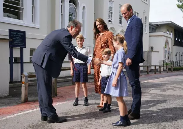 George, Charlotte and Louis shook hands with their new headmaster