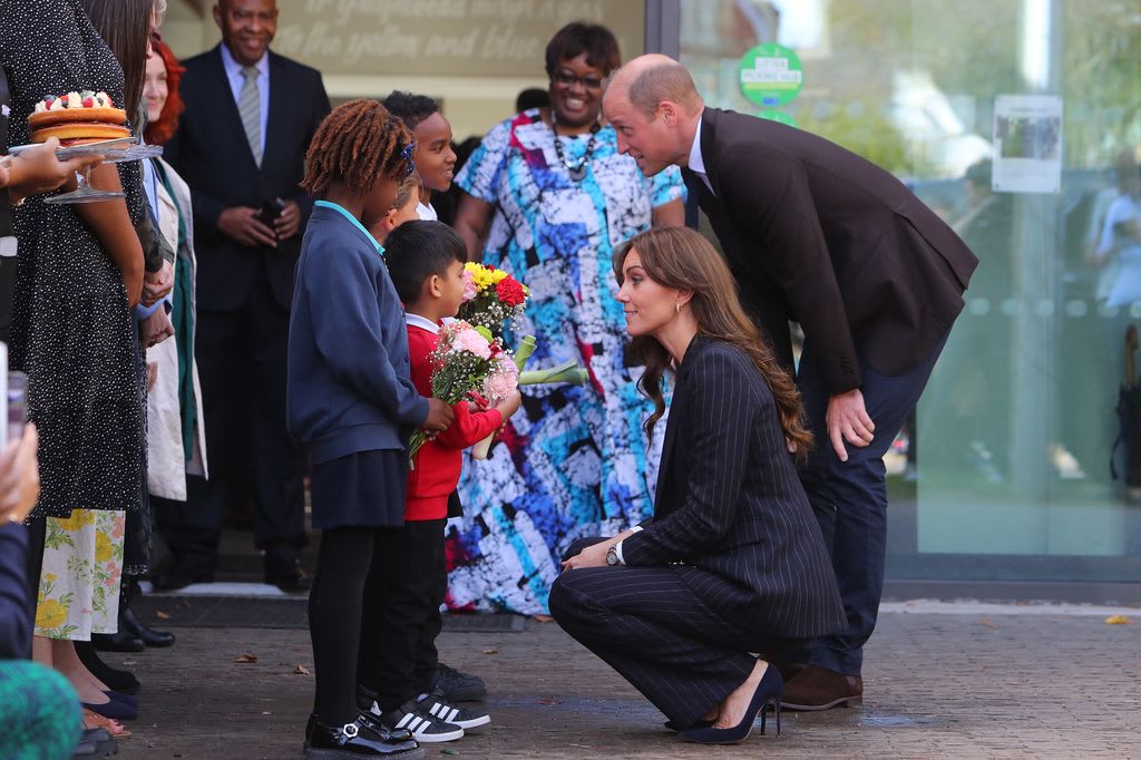 William and Kate receive posies from Akachi, 6, Humzah, 6, Ayla-May, 7, and Mazin, 8, at the end of a visit to the Grange Pavilion