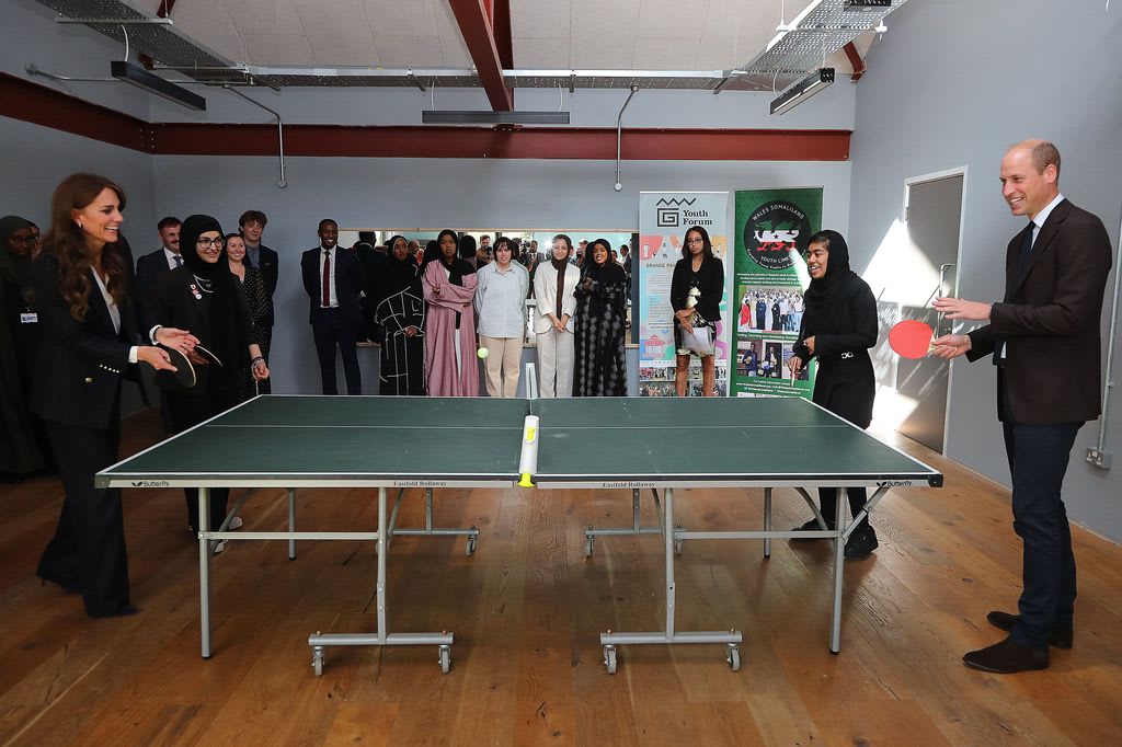 William and Kate play table tennis during a visit to the Grange Pavilion in Cardiff