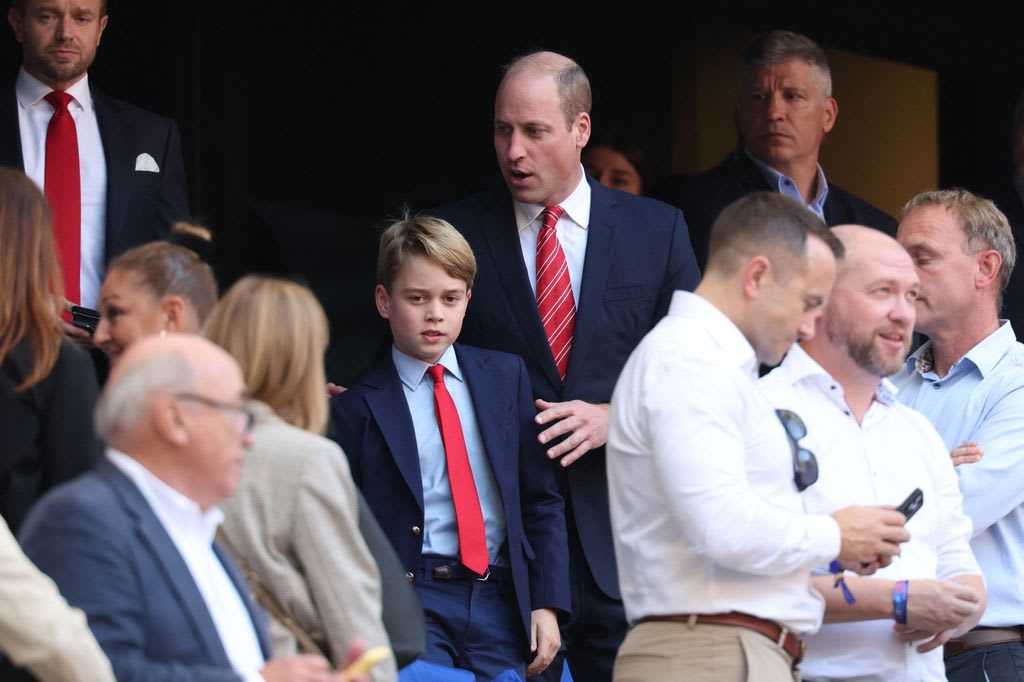William and George made their way to their seats at the rugby