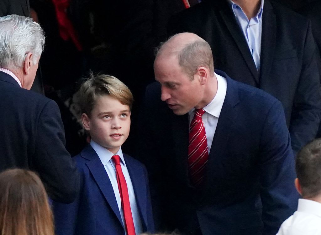 Prince George looked fed up as his dad spoke to him