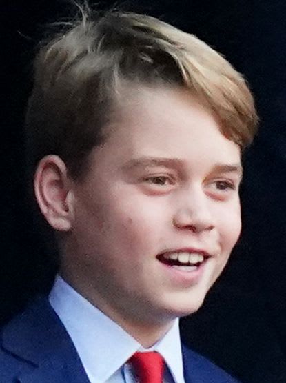 Prince George smiling at the rugby