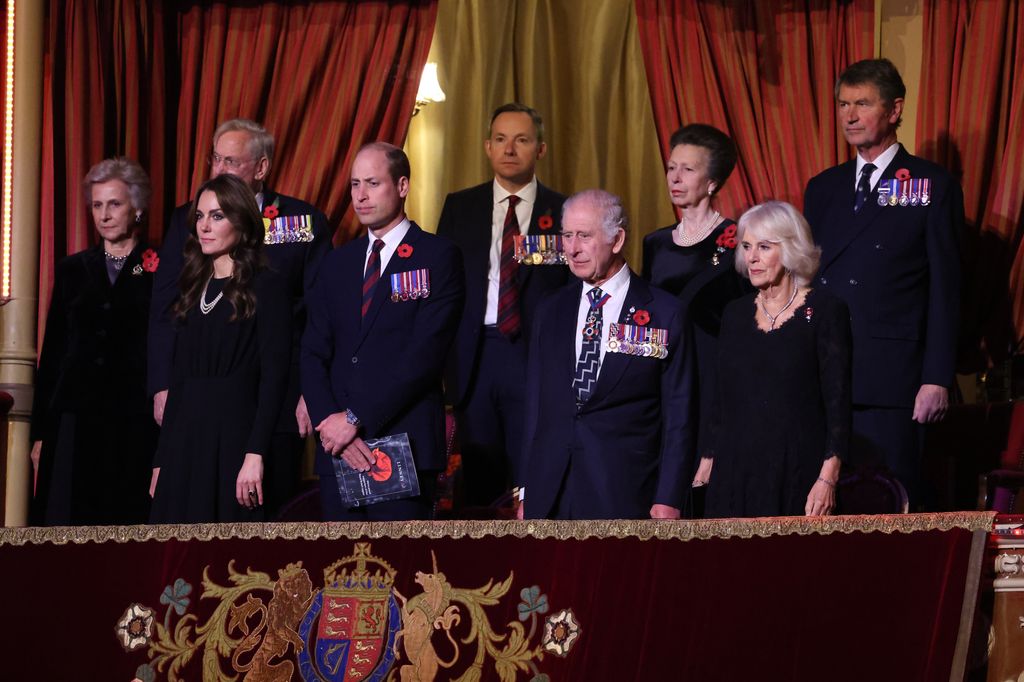 Members of the British Royal Family stood in a royal box
