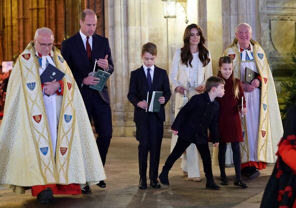 Prince Louis tries to blow Princess Charlotte's candle