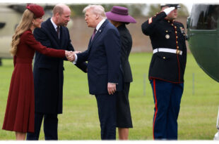 Donald Trump shaking hands with Prince William while lightly touching his arm after stepping off Marine One at Windsor Castle