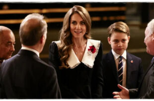 Prince George standing beside Princess Kate during his first royal appearance honouring the British Armed Forces