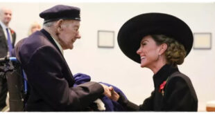 Princess Kate smiling warmly while speaking with a 100-year-old veteran who shared his secret to a long life