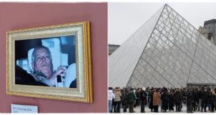 Photograph of Prince Andrew displayed on a wall inside the Louvre Museum