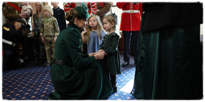 Princess Kate interacting with a young girl during the Irish Guards St Patrick's Day celebration