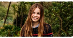 Princess Charlotte smiling in a candid photo showing her longest hair yet for her 11th birthday