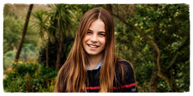 Princess Charlotte smiling in a candid photo showing her longest hair yet for her 11th birthday
