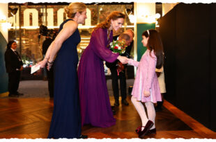 Four-year-old Sahrae-Lea Herbert performing a curtsy in front of Prince William and Princess Kate at the Digger premiere